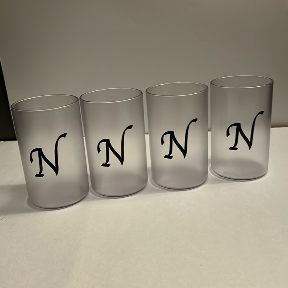 Set of 4 Bentley acrylic glasses with “N” on them.  The “N” is black. NWOT